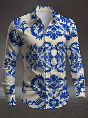 A men's long-sleeved button-up shirt featuring a blue and white floral damask pattern.