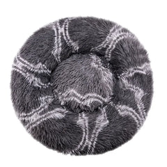 A round, plush pet bed in dark grey with a white wavy pattern, viewed from directly above.
