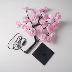 A pink rose flower tree LED table lamp with a black base and a USB power cord.