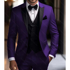 A man wears a slim-fit purple three-piece tuxedo with a black peak lapel, vest, and bow tie.