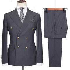 A charcoal grey double-breasted suit with gold buttons, a white shirt, and a patterned tie.