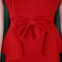 A close-up of a red sheath dress featuring a decorative bow at the waist and a peplum detail.