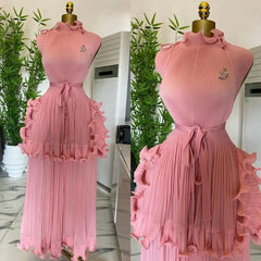 A sleeveless pink pleated midi dress with a ruffled peplum waist and a matching tie belt.