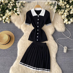 A black and white knit two-piece set featuring a polo-collar shirt and a pleated mini skirt.