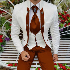 A man wears a white patterned jacket with brown accents, a matching vest, and brown trousers.