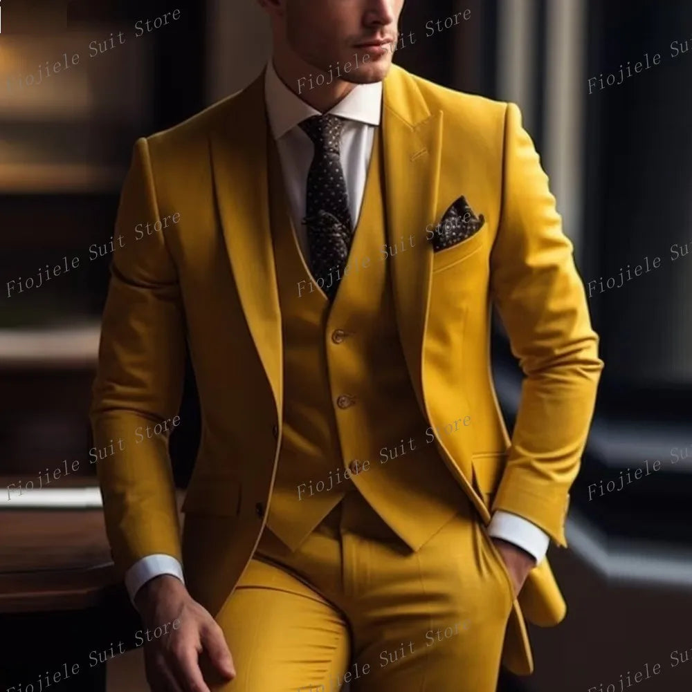 A man wears a mustard yellow three-piece suit with a white shirt and a dark patterned tie.
