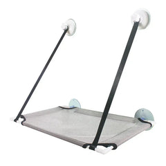 A grey mesh cat hammock with white plastic frame and four suction cups for window mounting.