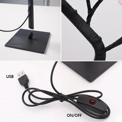A black rose tree LED table lamp with a USB power cable and an inline on-off switch.