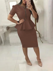 A woman wears a brown two-piece set featuring a v-neck peplum top with a zipper and a pencil skirt.