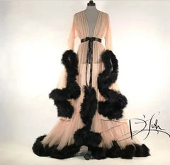 Deep V-neck tulle maternity dress with lace details, long sleeves, feather accents, ideal for photo shoots and special occasions.