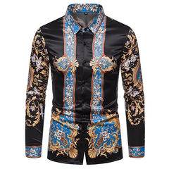 A men's long-sleeve button-down shirt featuring a black base with ornate blue and gold floral patterns.
