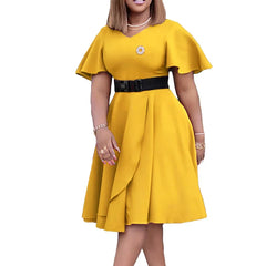 A woman wears a yellow knee-length V-neck dress with short flutter sleeves and a black belt.