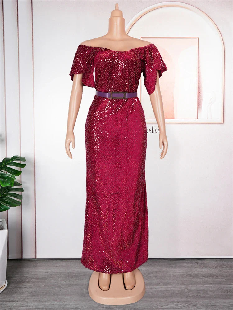 A floor-length, off-the-shoulder burgundy sequin mermaid dress with petal sleeves and a belt.