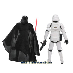 Two Star Wars action figures, Darth Vader and a Stormtrooper, stand side by side.