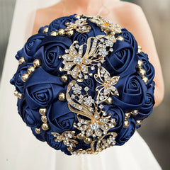 A round navy blue silk rose wedding bouquet decorated with gold and crystal butterfly brooches.