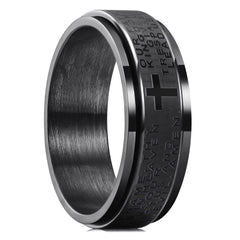 A black stainless steel spinner ring with a Christian cross and religious text.
