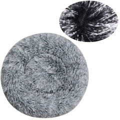 A round, grey plush pet bed with a soft, shaggy texture and a close-up detail view.