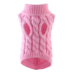 A pink cable-knit sweater for small to medium pets featuring a turtleneck and arm holes.