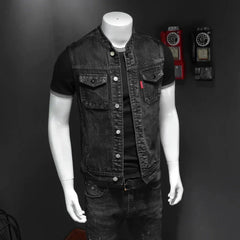A black denim vest for men featuring a stand collar, button front, and two chest pockets.