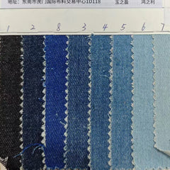 A fabric swatch card showing eight shades of blue denim ranging from dark to light.