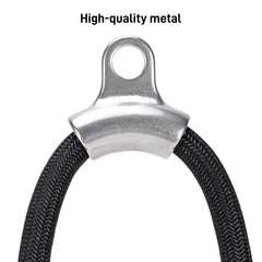 A close-up of a silver metal attachment point connecting to a black braided tricep rope.