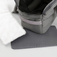 A grey quilted pet carrier bag shown with a matching grey base mat and a white faux fur liner.