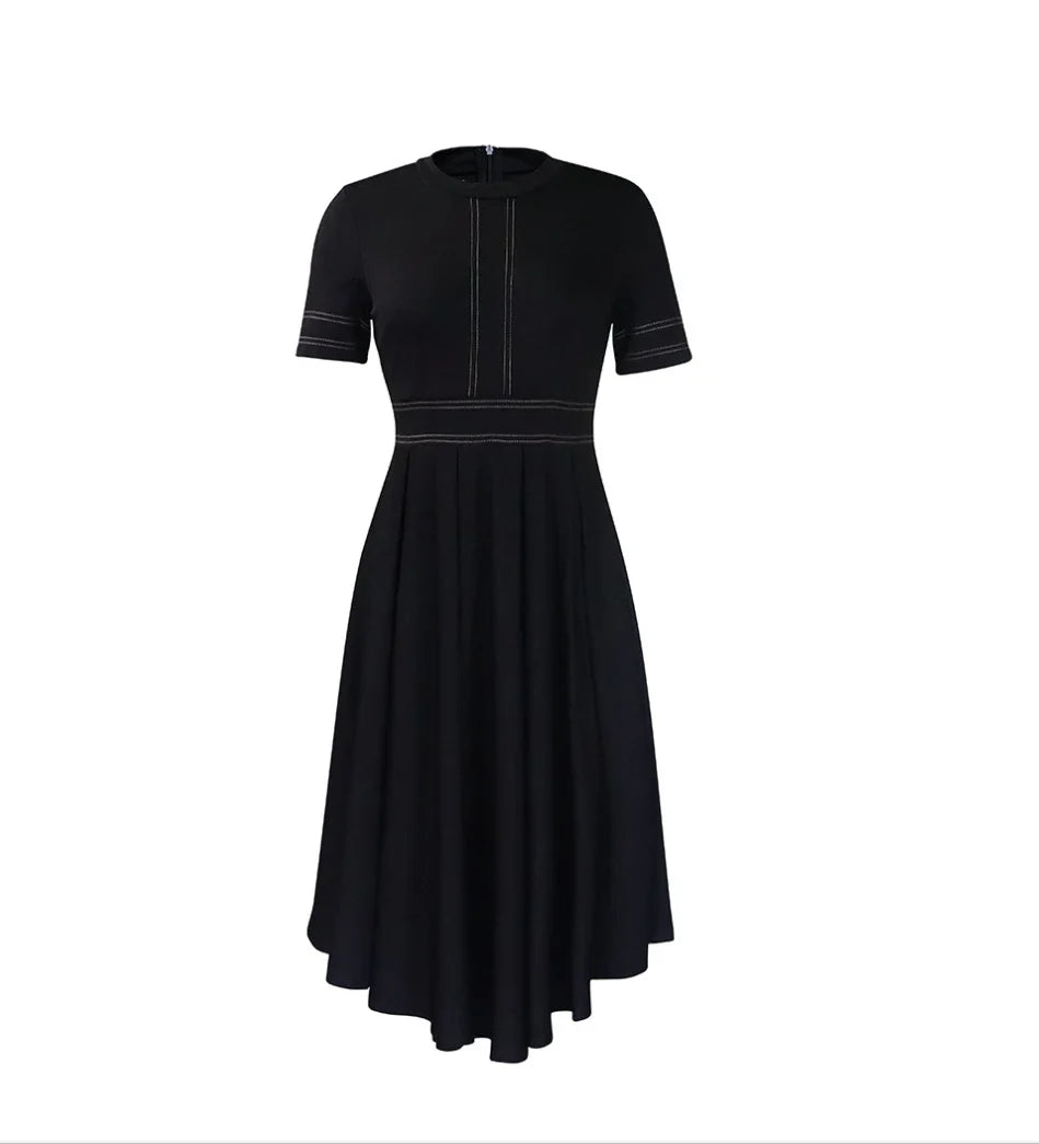 A black short-sleeved A-line dress with white contrast stitching and a pleated high-low skirt.