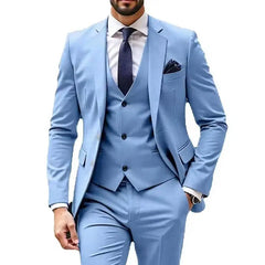 A man wears a light blue three-piece suit featuring a single-breasted jacket, vest, and trousers.