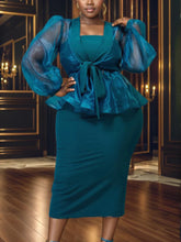 A teal two-piece set featuring a sheer puff-sleeve peplum top and a matching midi skirt.