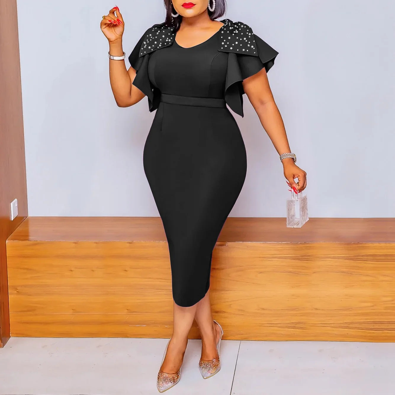 A black midi bodycon dress with a V-neck, ruffled butterfly sleeves, and beaded shoulder details.