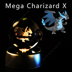 A glass crystal ball featuring a 3D laser-etched Mega Charizard X figure on an illuminated base.