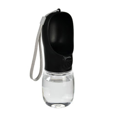 A portable black pet water bottle with a built-in drinking bowl and a grey carrying strap.