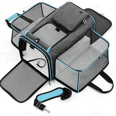 A grey, foldable pet carrier with mesh windows and a detachable shoulder strap.