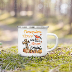 A white enamel camping mug featuring a fall-themed design with pumpkins, a cross, and text.