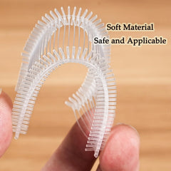 A close-up of a flexible, U-shaped plastic micro stitch fastener strip held between two fingers.