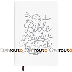 A white Bible study journal with silver calligraphy text and a small cross icon on the cover.
