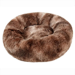 A round, brown plush pet bed with a soft, shaggy texture.