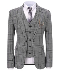 A grey houndstooth three-piece suit featuring a single-button jacket, vest, and tie.