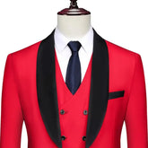 A red three-piece tuxedo with a black shawl lapel, white shirt, and dark tie.