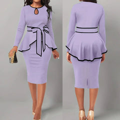 A light purple two-piece set featuring a long-sleeved peplum top with a tie waist and a midi skirt.
