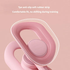 A close-up of a pink pelvic floor muscle trainer featuring a soft TPE rubber grip.