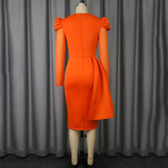 A back view of an orange midi sheath dress featuring long lace sleeves, puffed shoulders, and a side peplum detail.