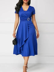 A royal blue short-sleeve midi dress with a V-neck, ruched waist, and an asymmetric hem.