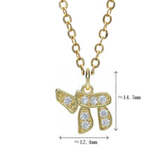 A gold-toned copper pendant necklace featuring the Hebrew Chai symbol accented with zircon stones.