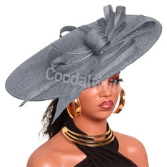Elegant pink derby fascinator hat headband with large wedding and church millinery cap, perfect for bridal and formal occasions.