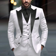 A man wears a white three-piece tuxedo with a black lapel, black vest, and black dress shirt.
