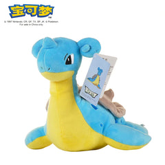 A blue and yellow Lapras plush toy with a tag attached to its neck.