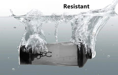 A black and clear electric protein shaker cup submerged in water with bubbles.