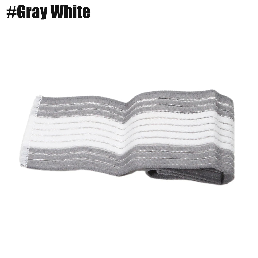 A gray and white striped elastic compression bandage is shown partially unrolled.