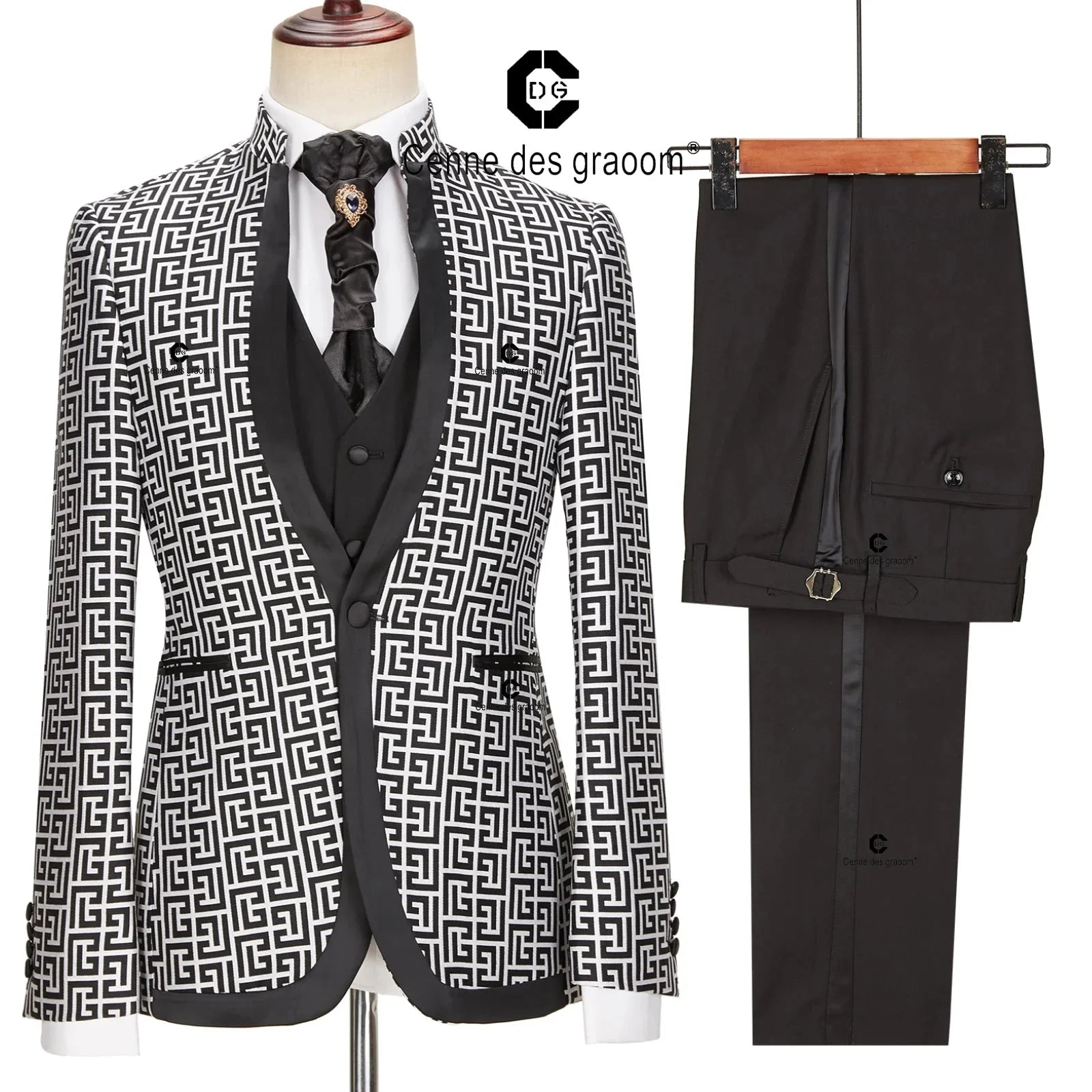 A three-piece men's suit featuring a black and white geometric patterned blazer, vest, and pants.